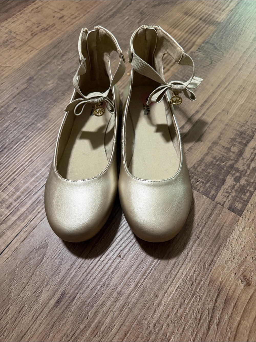 Michael Kors Gold Ballet Flats with Ankle Tie and Logo Charm